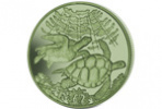 Зеленые черепахи на титановой монете