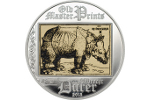 На серебряной монете показана гравюра Дюрера «Носорог»