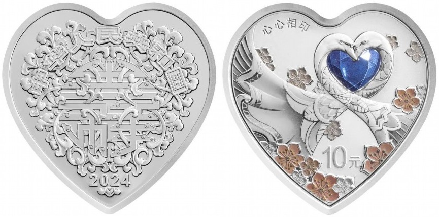 Лебеди на серебряных 10 юанях. Китай