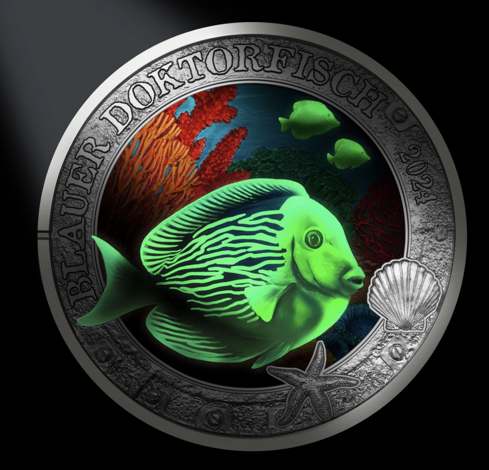 Коллекционная монета «Рыба-хирург» при УФ-излучении. Австрия